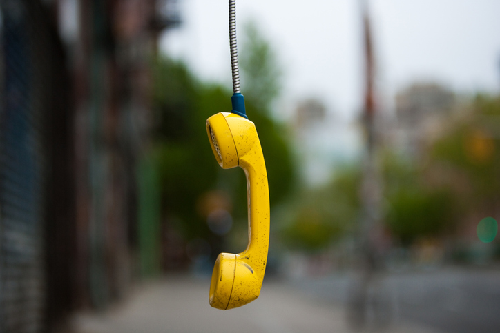 Streets of New York City. USA. An abandoned telephone receiver. for article on non-responsive parents