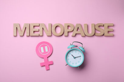 Menopause spelled out with a female symbol and a stop watch