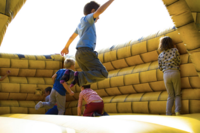 Small child jumping in bounce house for education story on math anxiety