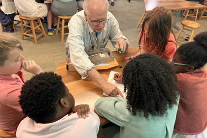 During an “Identifying Minerals” field trip at the National Museum of Natural History, students learn how to identify a variety of minerals by testing their luster, streak, hardness, color and magnetism with a museum educator and volunteers supporting facilitation. The program pairs well with a visit to the museum’s Geology, Gems and Minerals Hall afterwards, putting what the students learned into context. (Ashley Naranjo)