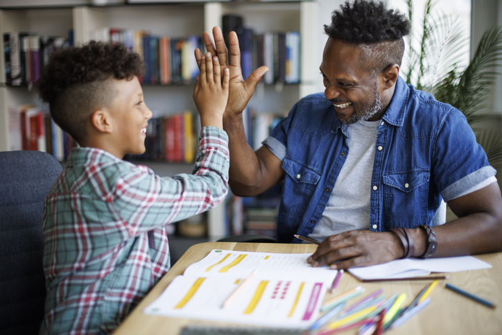 Father helping son with homework