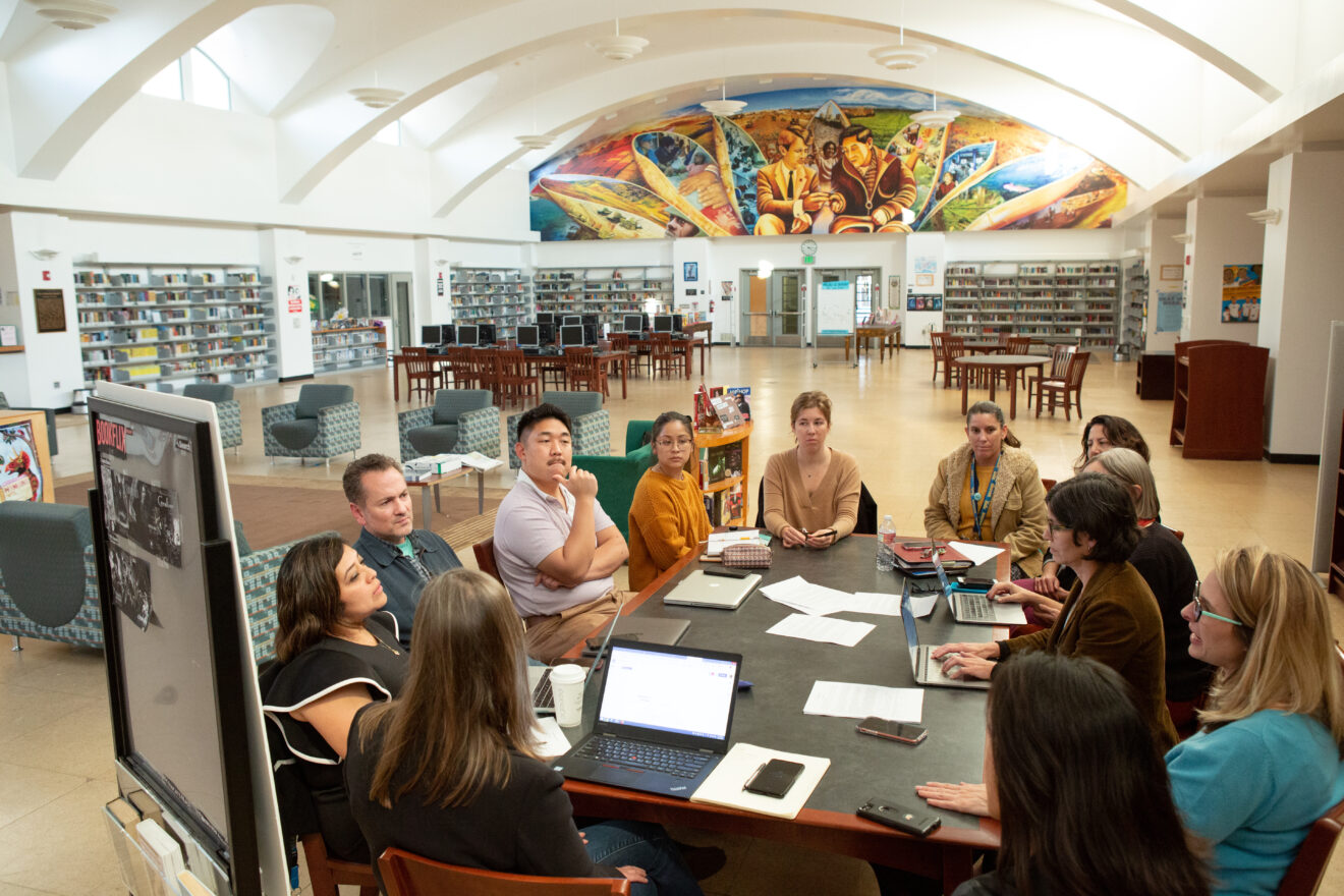 Teachers and staff from UCLA Community School meet with UCLA professors to discuss the various research projects happening at the school. for article on teacher microcredentials