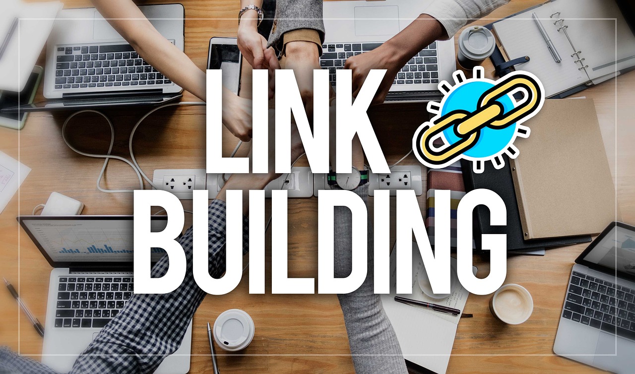 An image looking down at open laptops, with users fist-bumping, and then the words "link building" superimposed over that. Used for SmartBrief Original with headline: 5 top B2B link-building strategies