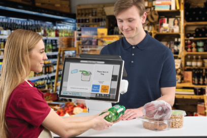 Customers using self checkout at a C-store